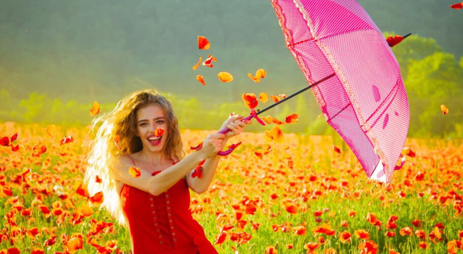happy girl with pink umbrella red poppyfield