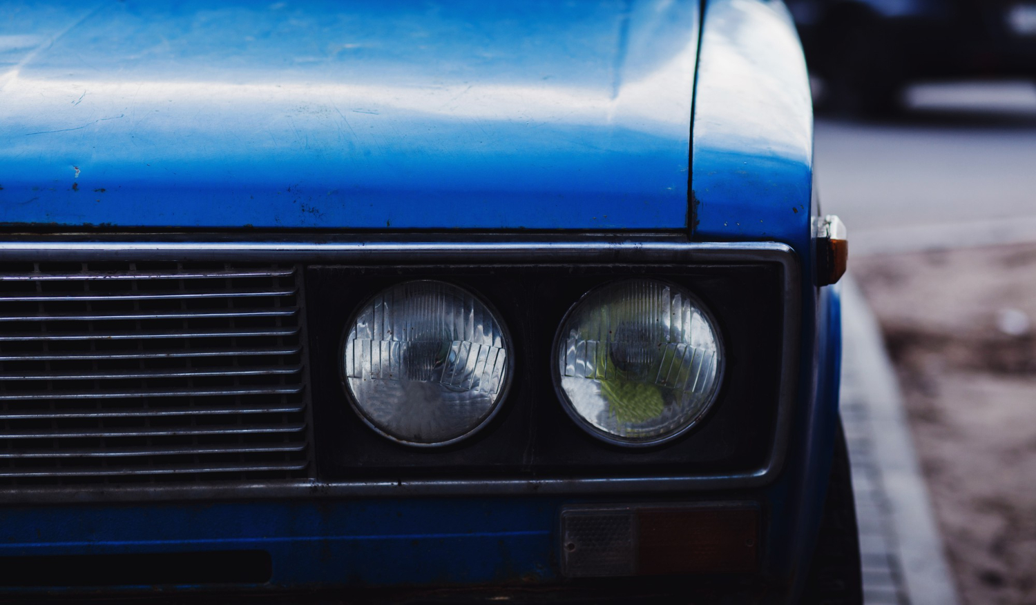 headlights on old retro vintage blue automobile