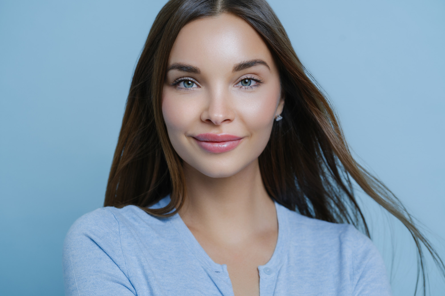 young woman with straight dark brunette hair with fresh makeup look