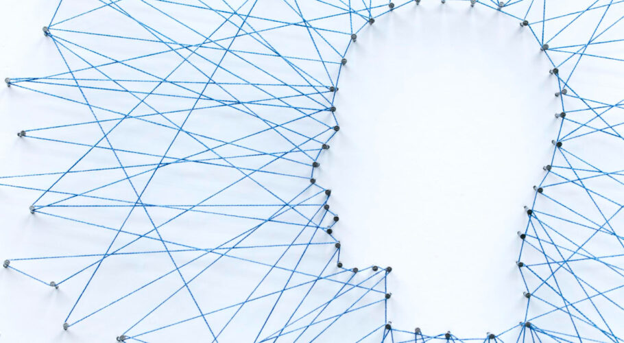 human head shape made from large grid pins connected with string communication technology mental health