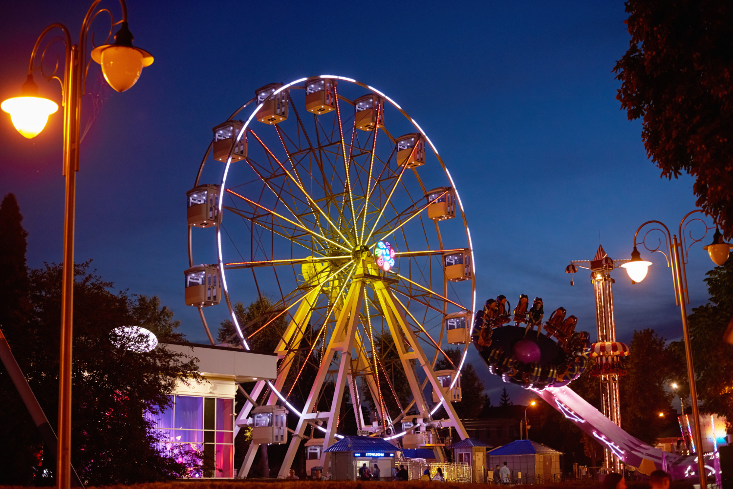 illuminated ferris wheel amusement park at night fishers ghost festival