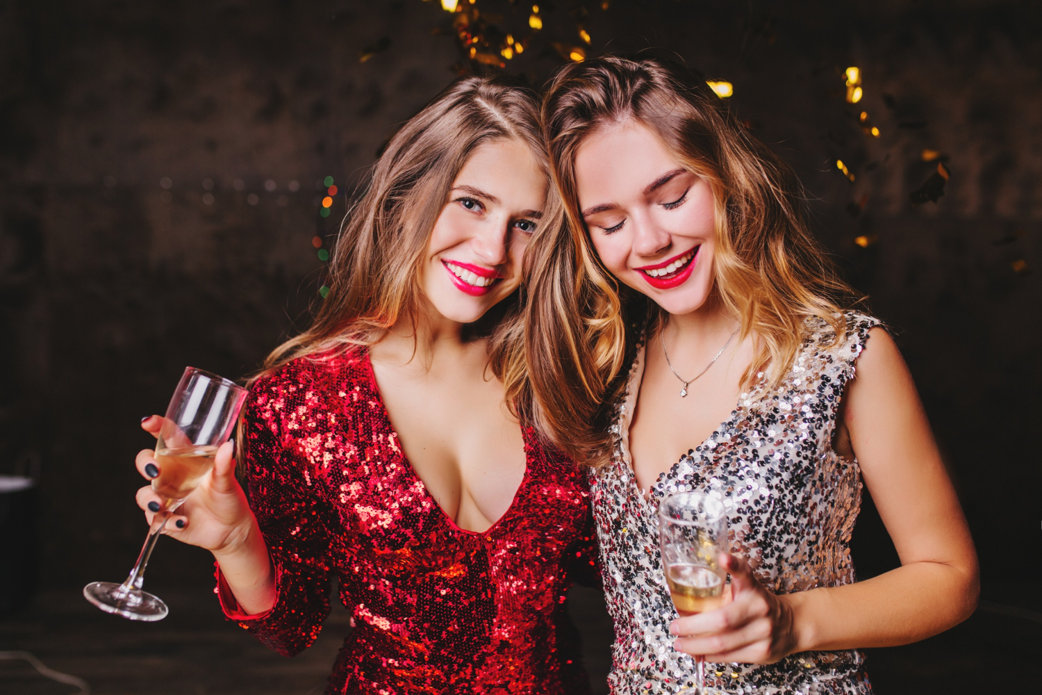 indoor clubbing young girls trendy in sparkle attire enjoying a party