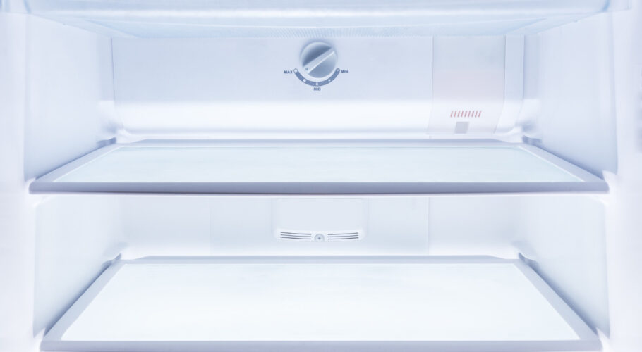 inside clean empty refrigerator with shelves