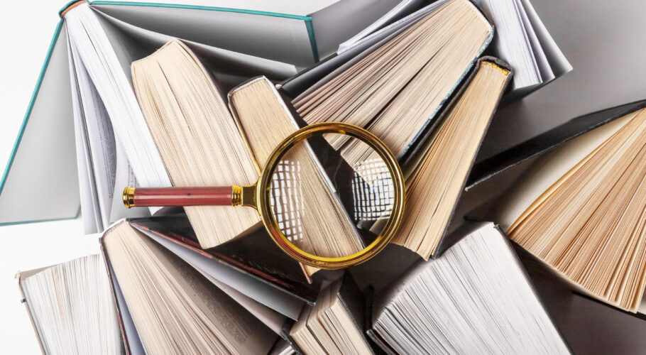 magnifier different books concept knowledge research studying