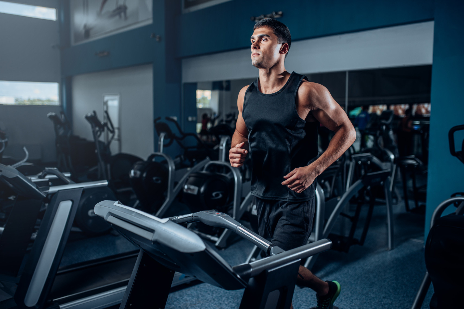 male athlete workout running exercise treadmill machine active sport training in the gym