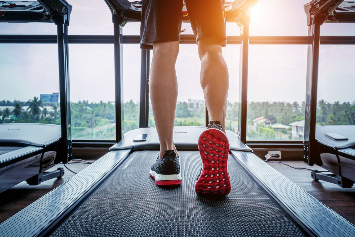 male feet sneakers running treadmill gym exercise