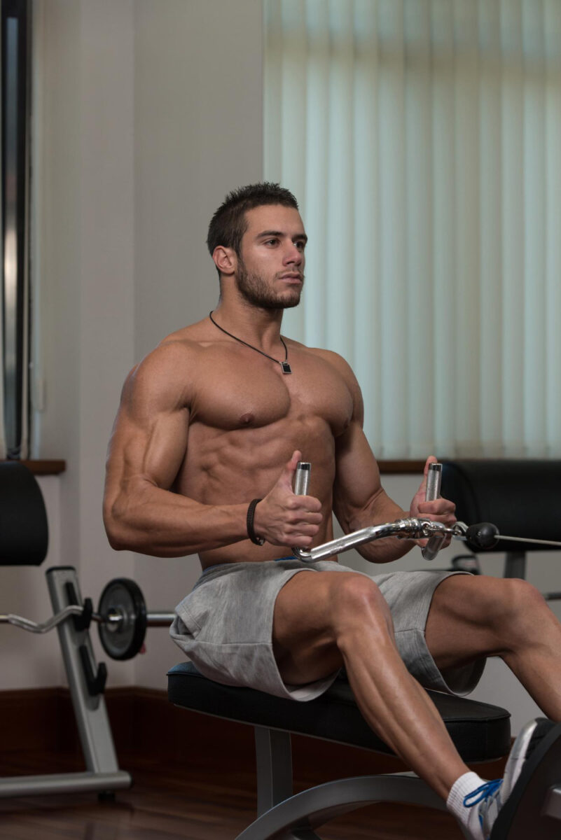 male fitness athlete doing heavy weight exercise back