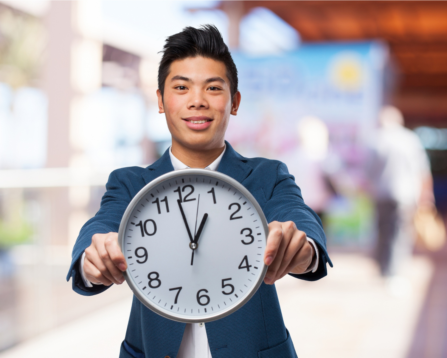 asian chinese man holding big clock time