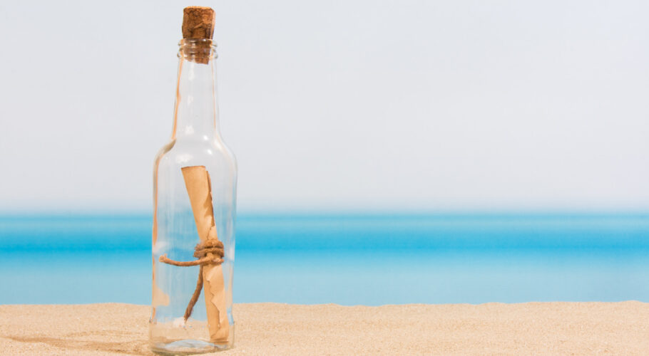message in a bottle on the sand