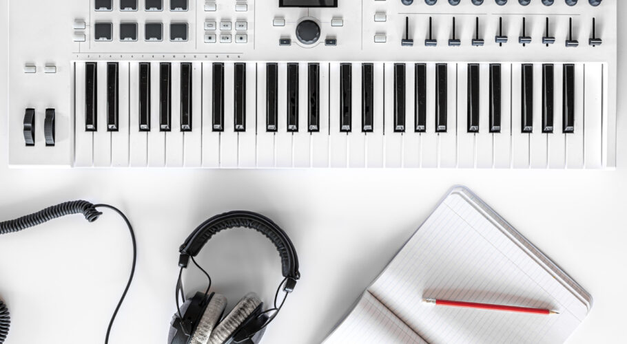 musical flat lay background with headphones musical keys