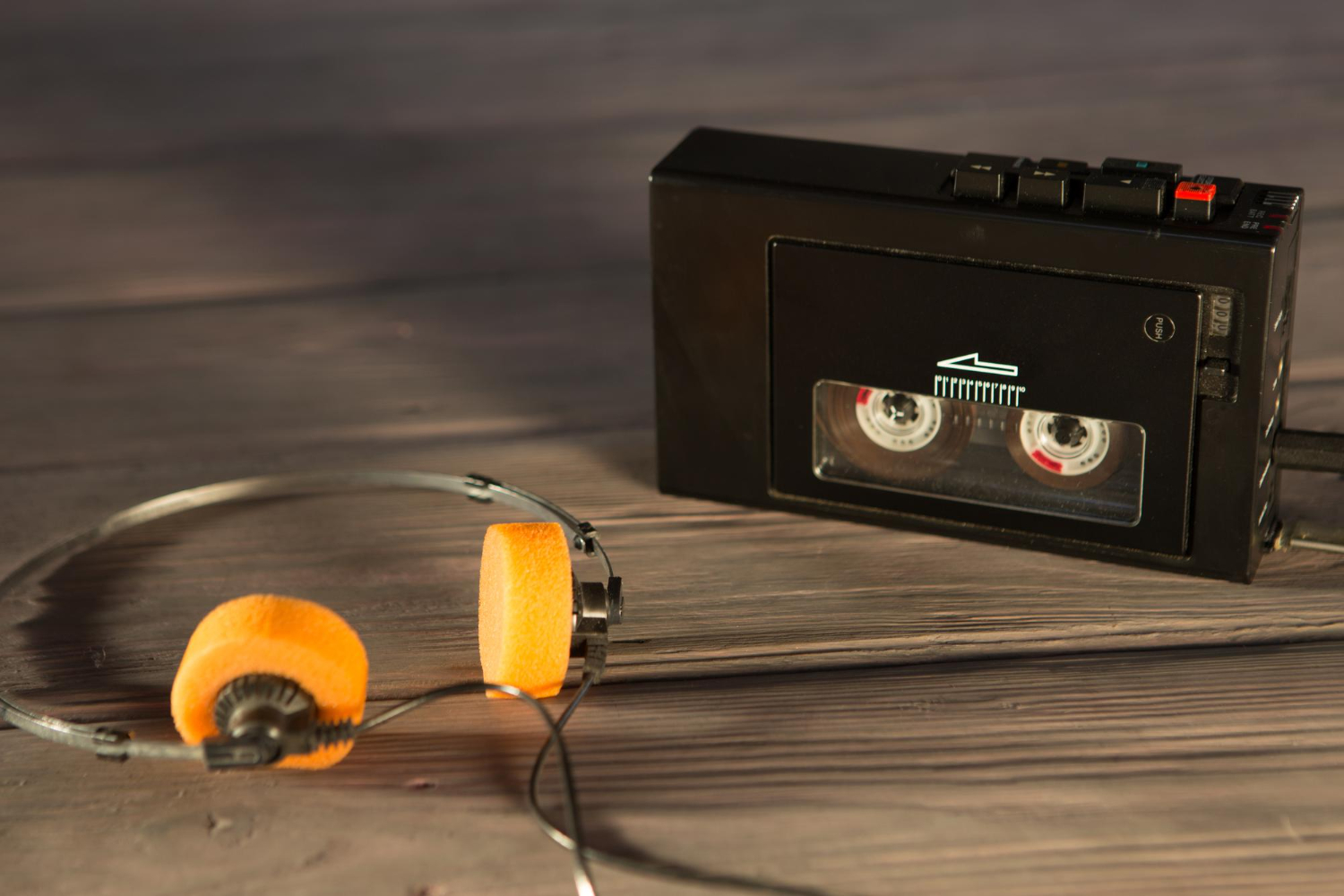 old portable cassette player headphones wooden