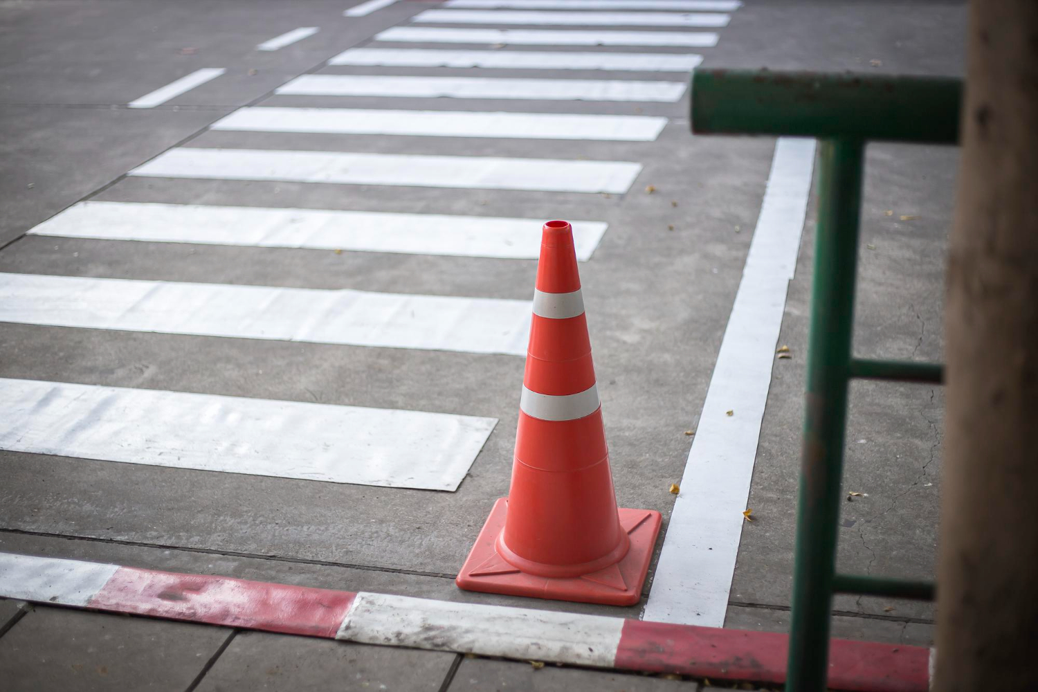 orange traffic cones cement road surface
