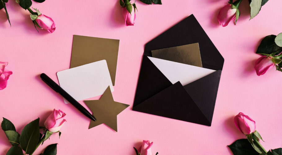 pink roses black envelope paper cards white golden color pen pink