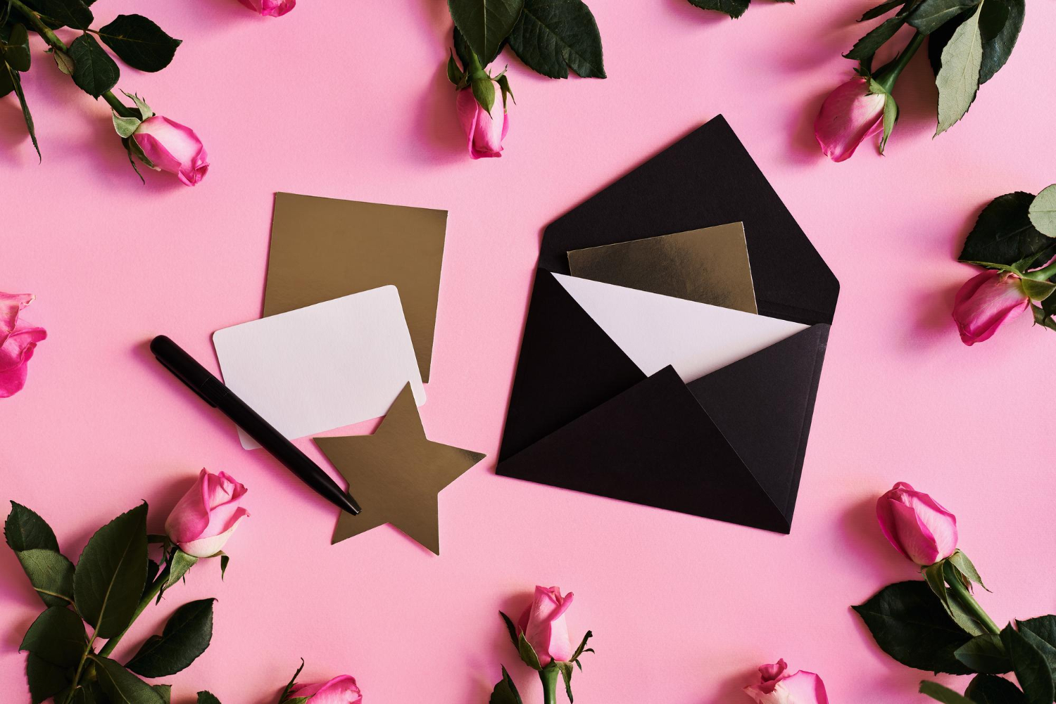 pink roses black envelope paper cards white golden color pen pink