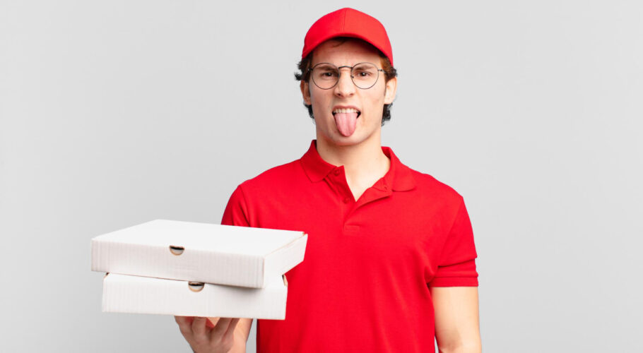 pizza hut delivery boy feeling irritated sticking his tongue out disliking something nasty