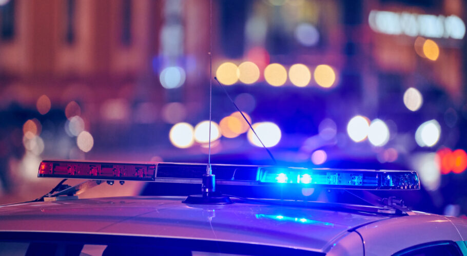 police car lights at night on city street red and blue lights