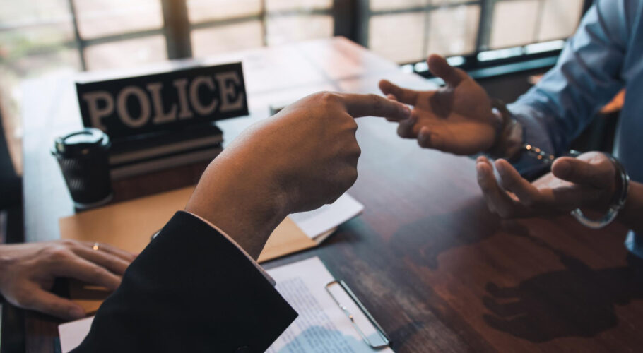 police officers pointed handcuffs offenders talked about offense corruption charges