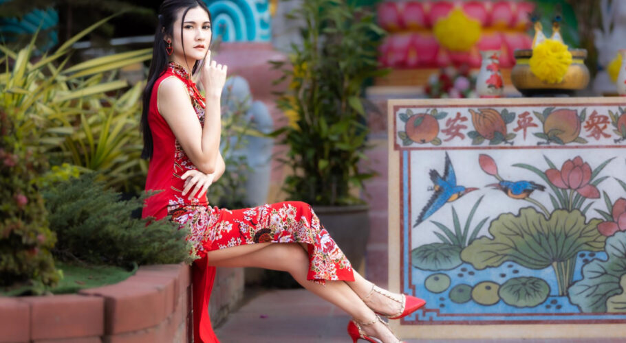 portrait beautiful smiles asian young woman in china wearing red cheongsam dress traditional decoration