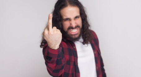 portrait happy handsome man with beard black long curly hair