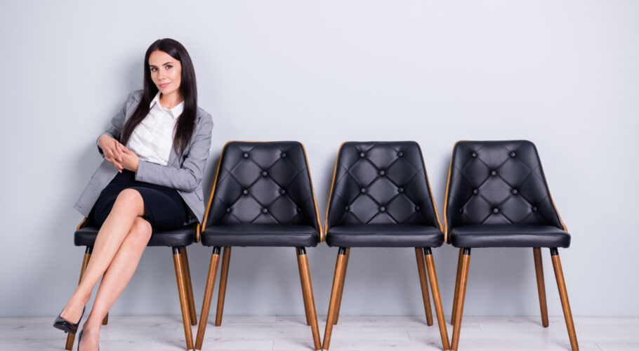portrait skilled confident successful lady real estate agent broker sitting chair expecting meeting leader partner