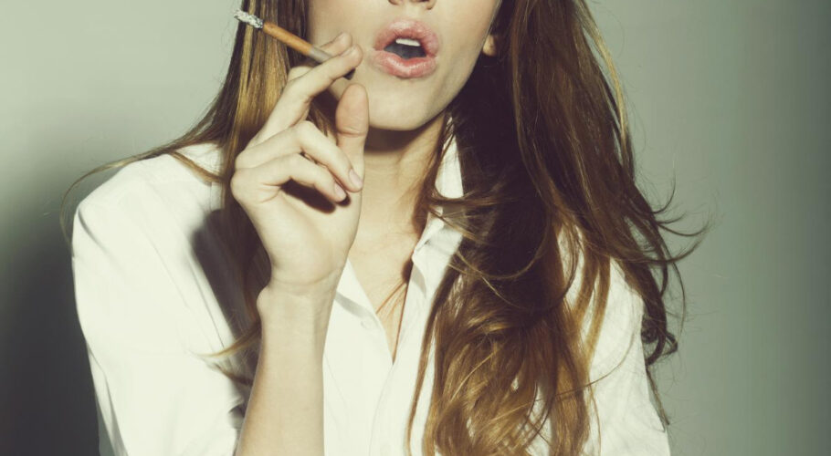 pretty sexy woman girl with long hair smoking cigarette