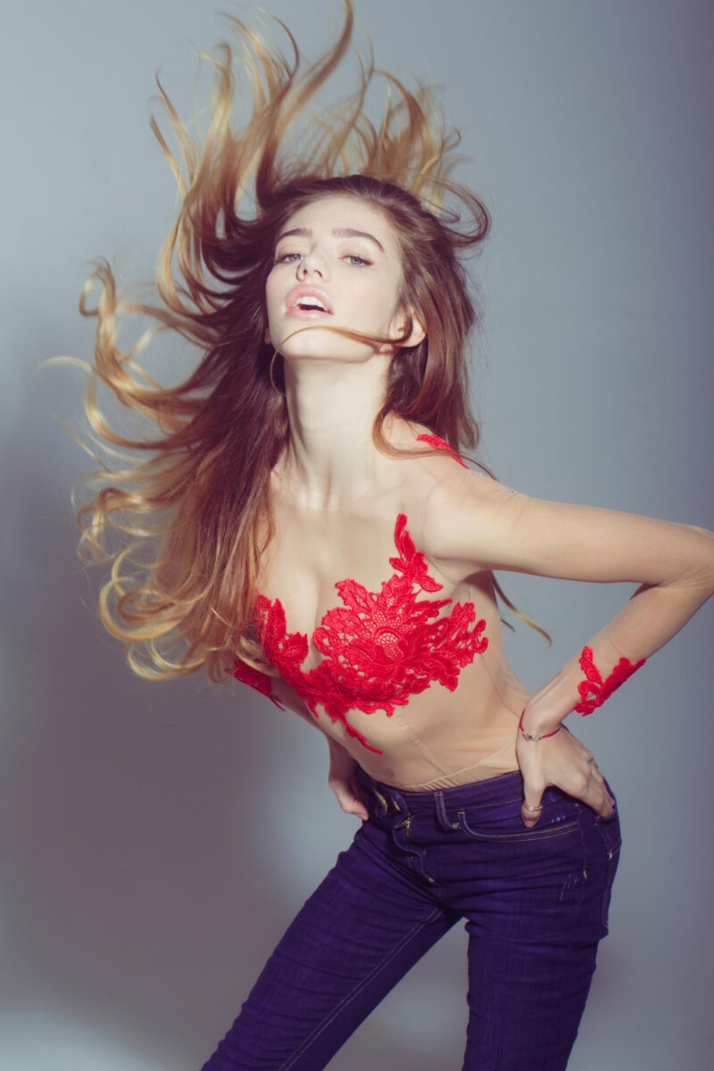 pretty sexy woman with long hair red embroidered bodysuit