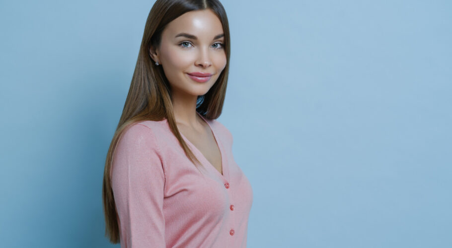beautiful charming brunette valerie woman wears casual pink jumper