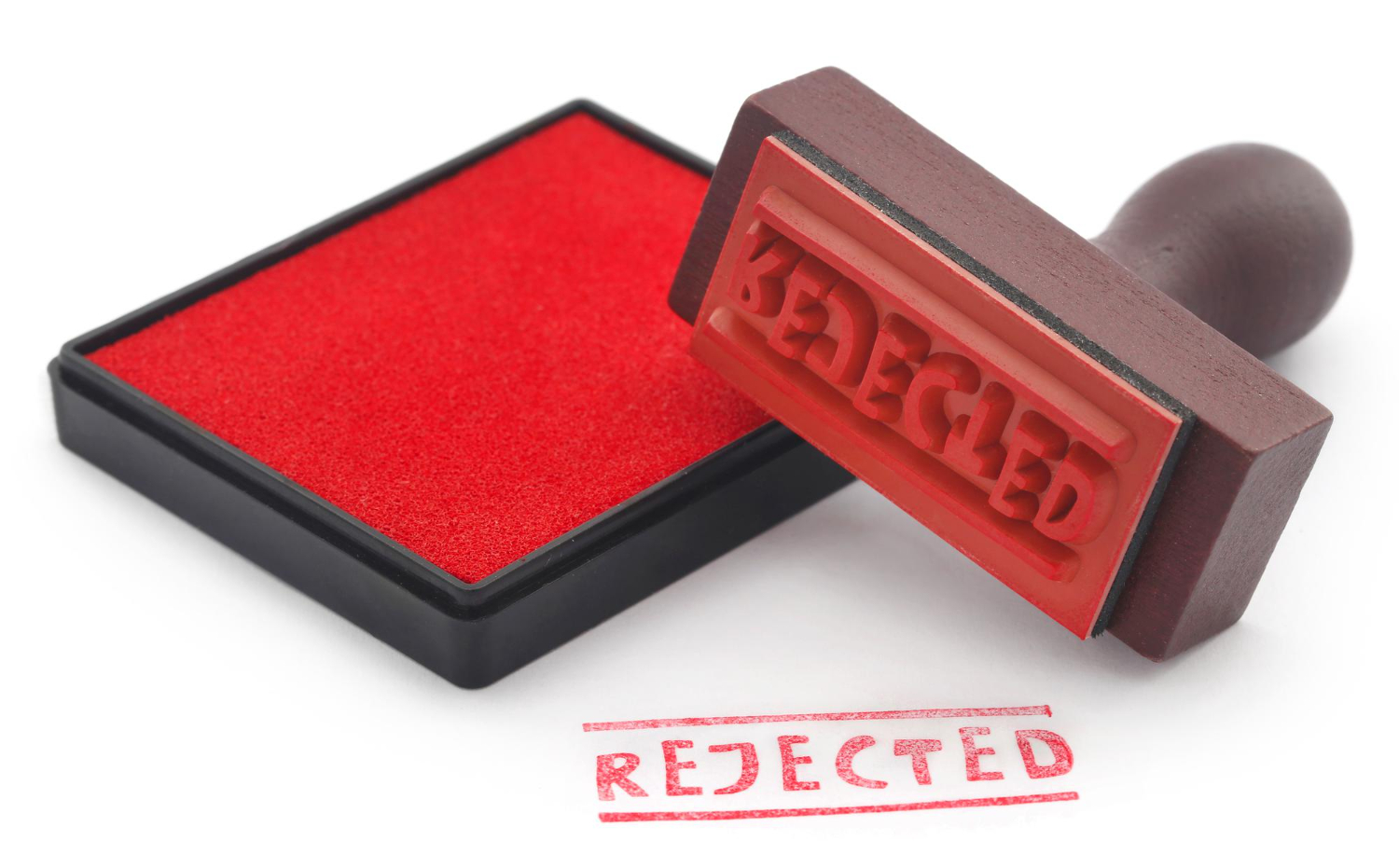 rejected rubber stamp with pad on white background