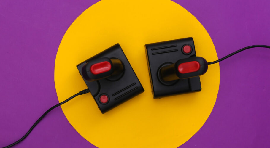 retro amiga 500 joysticks on purple background with top view