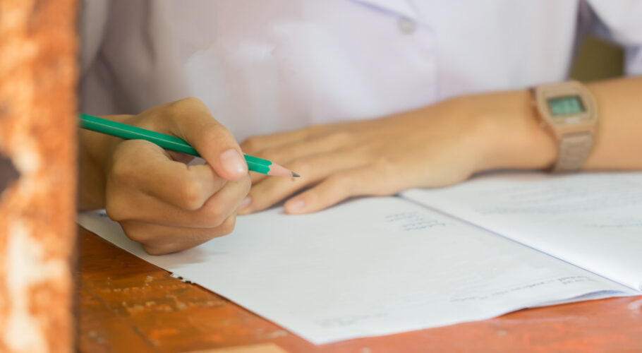 school university students hands taking exams writing examination room with holding pencil sheet lyssa