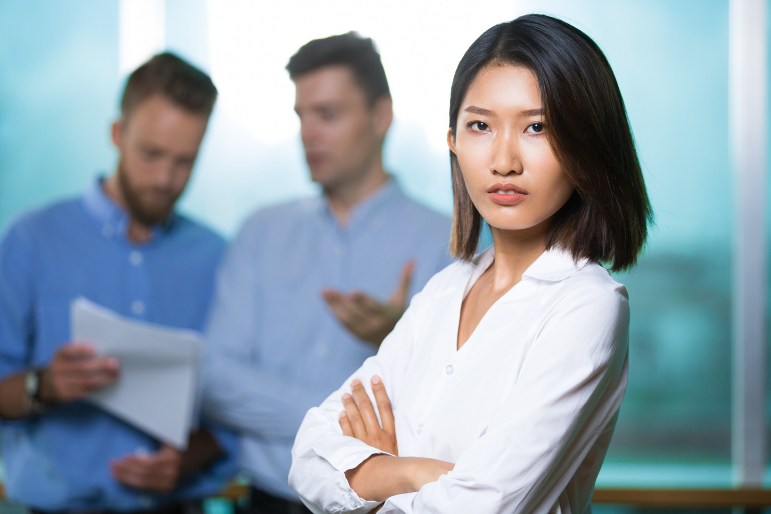 serious confident asian lady boss crossing arms