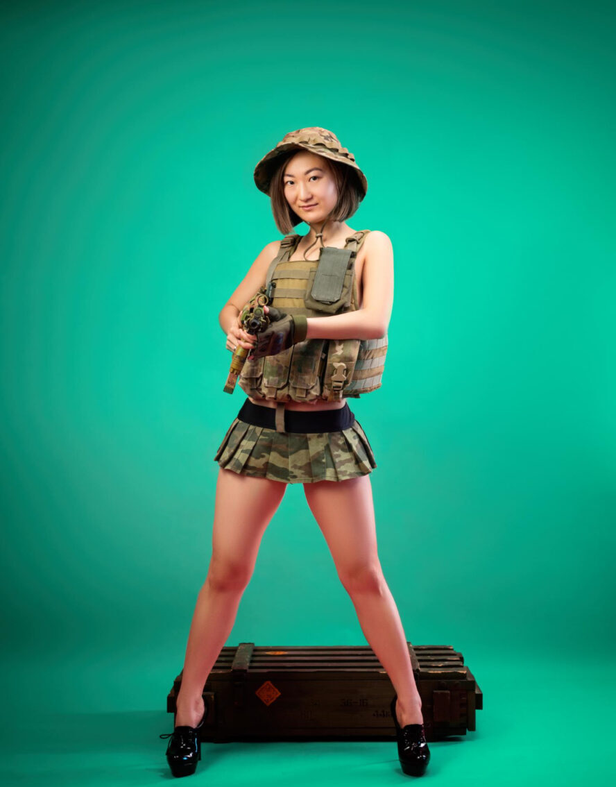 sexy asian woman military clothes with automatic rifle her hands while serving army