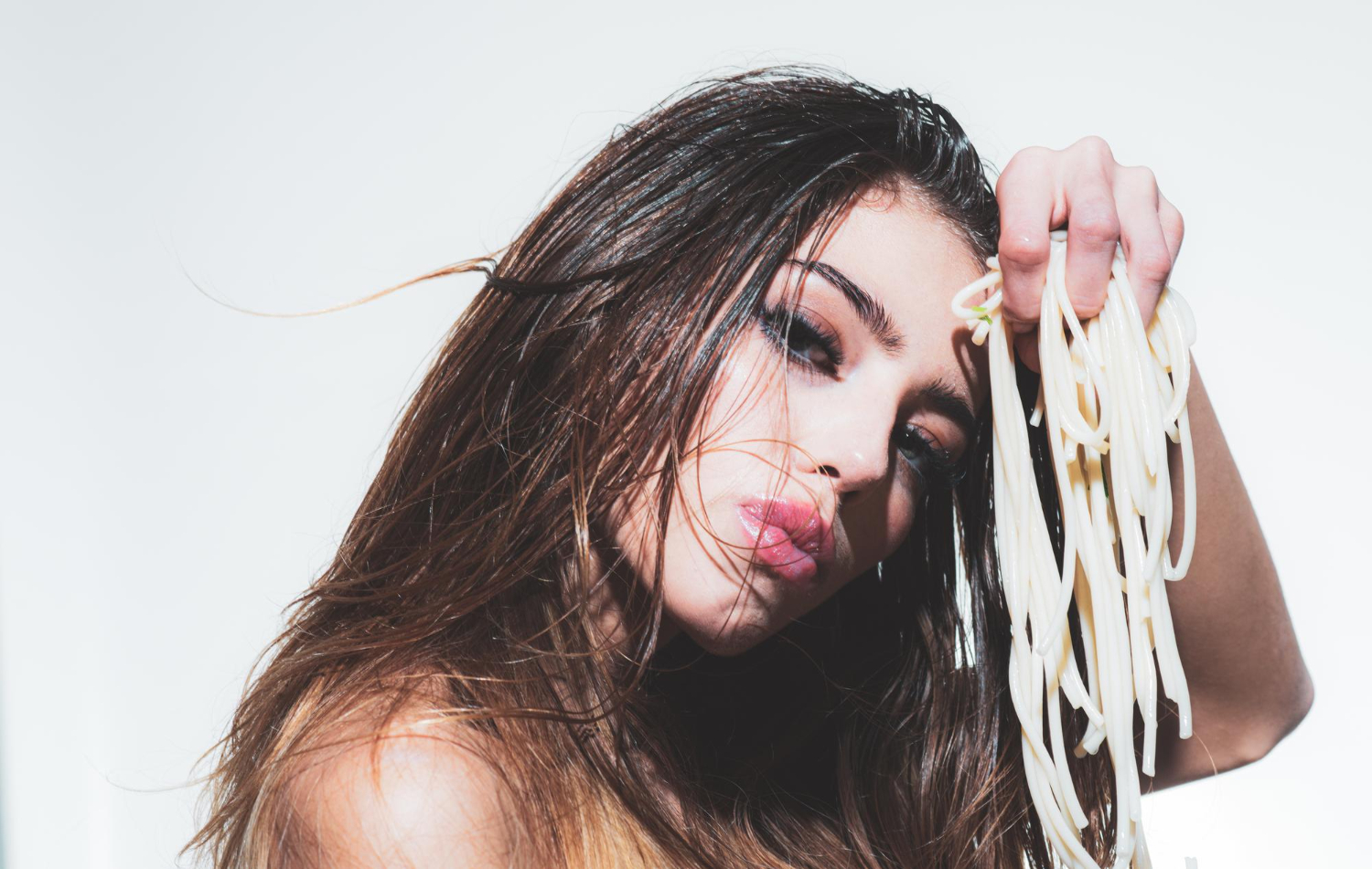 sexy woman eating spaghetti