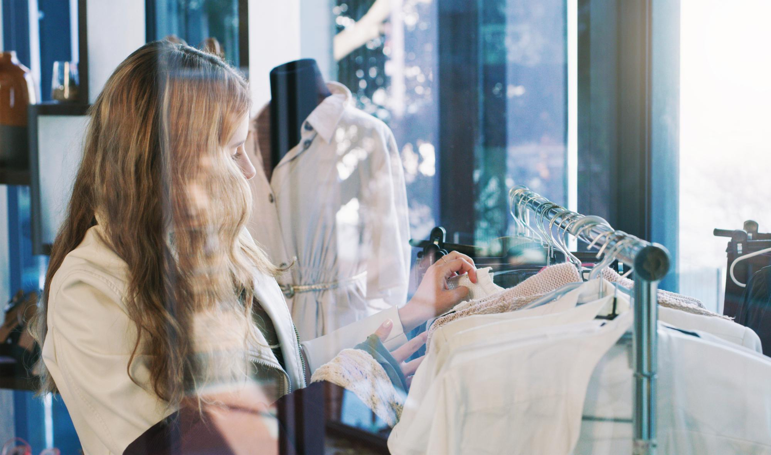 shop til you drop shot young woman browsing through clothes boutique