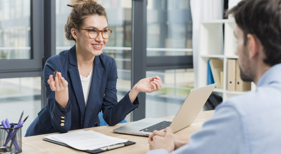 side view woman holding job interview with man