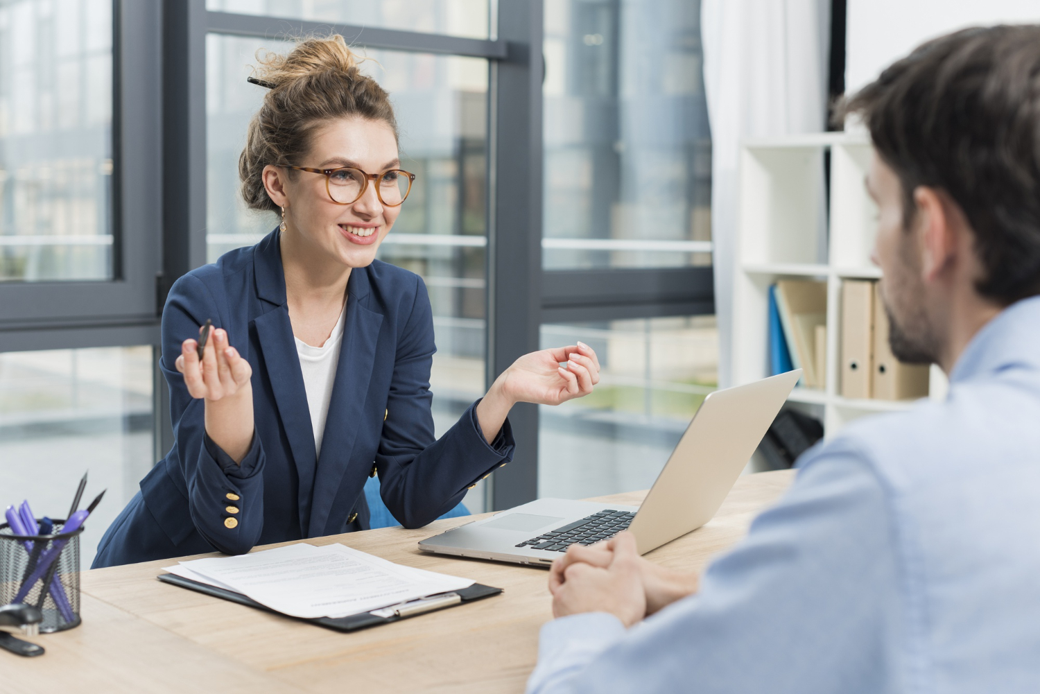 side view woman holding job interview with man