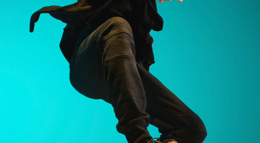 young male hip hop break dancer dancing karate