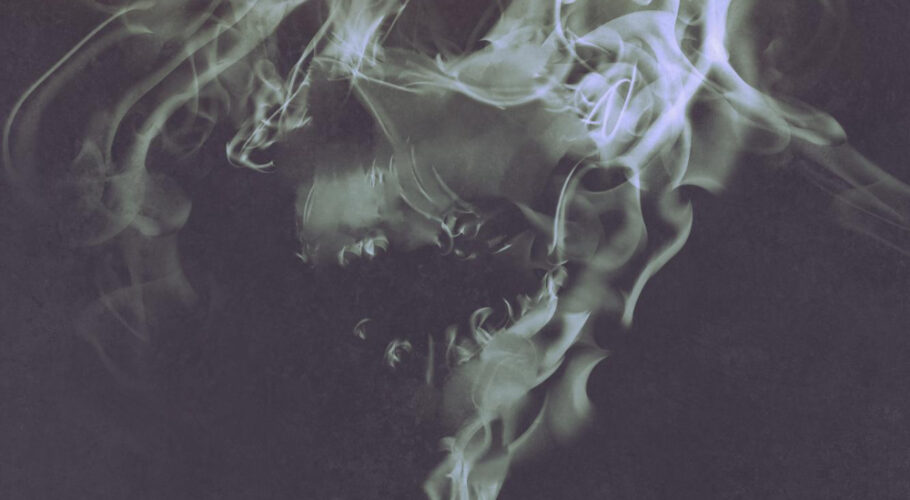skull shaped smoke comes out from burnt candle