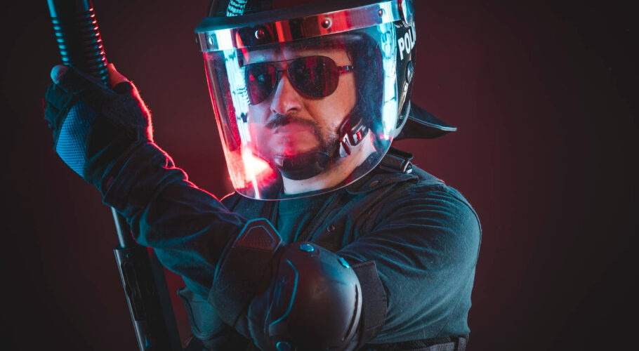 special riot police with red hazard lights armed man with helmet bulletproof vest
