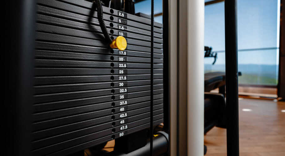 stacked iron plates weight machine in bodybuilding gym