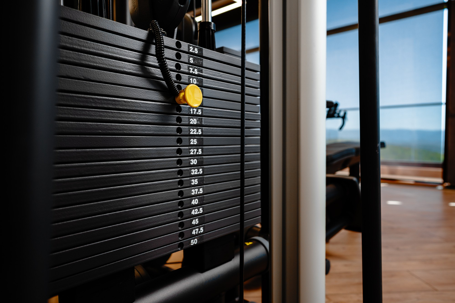 stacked iron plates weight machine in bodybuilding gym