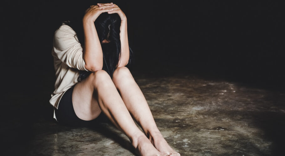 woman post rape seated on floor distraught