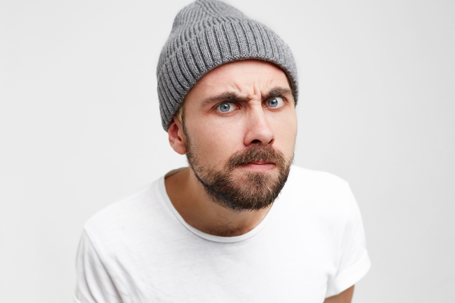 young man as if looking into peephole with interest shrill meticulously