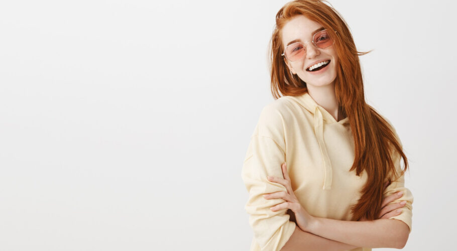 stylish happy gorgeous redhead girl cross arms chest smiling
