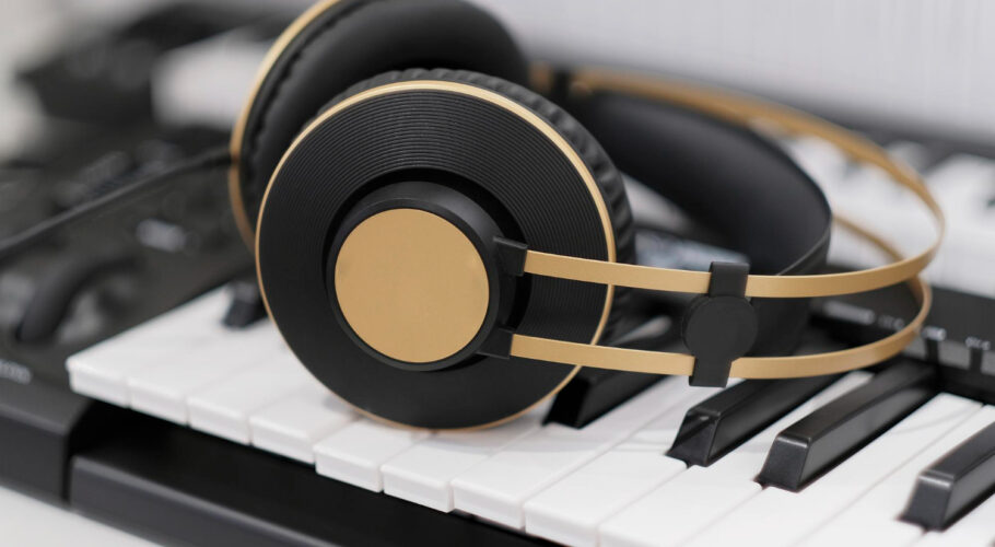 stylish modern headphones lie synthesizer close up songwriter create music