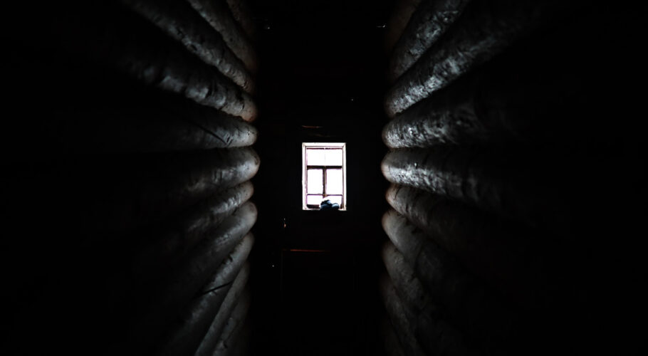sunlight coming through wooden window old dark room