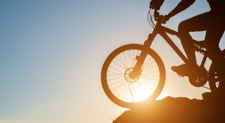 travel cycling on mountain bike through hills and freeways lifestyle
