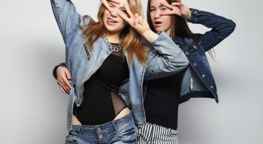 two young hipster girls having fun in the mall