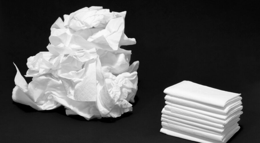 used and new tissues crumpled up by sick person with cold or flu