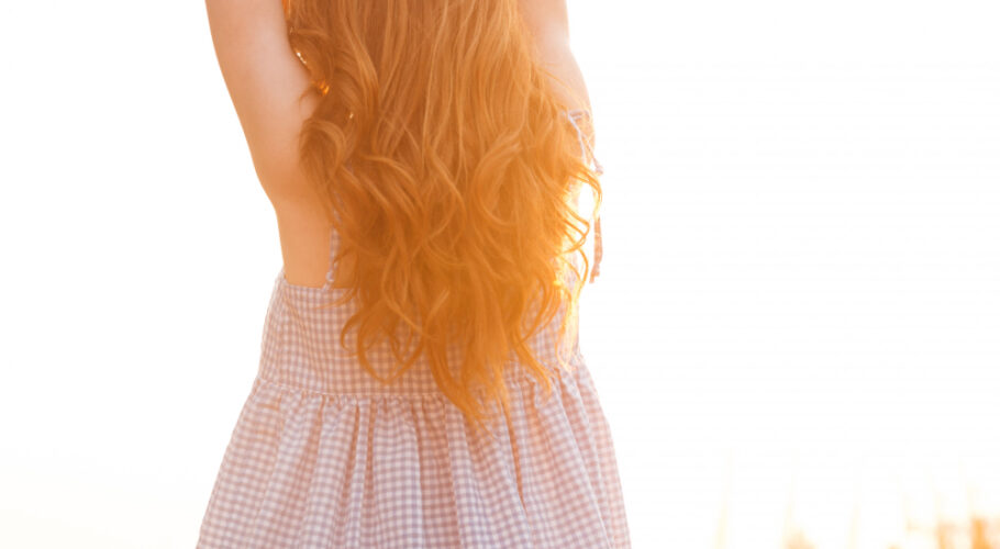 kathryn with ginger red hair woman posing with back to camera